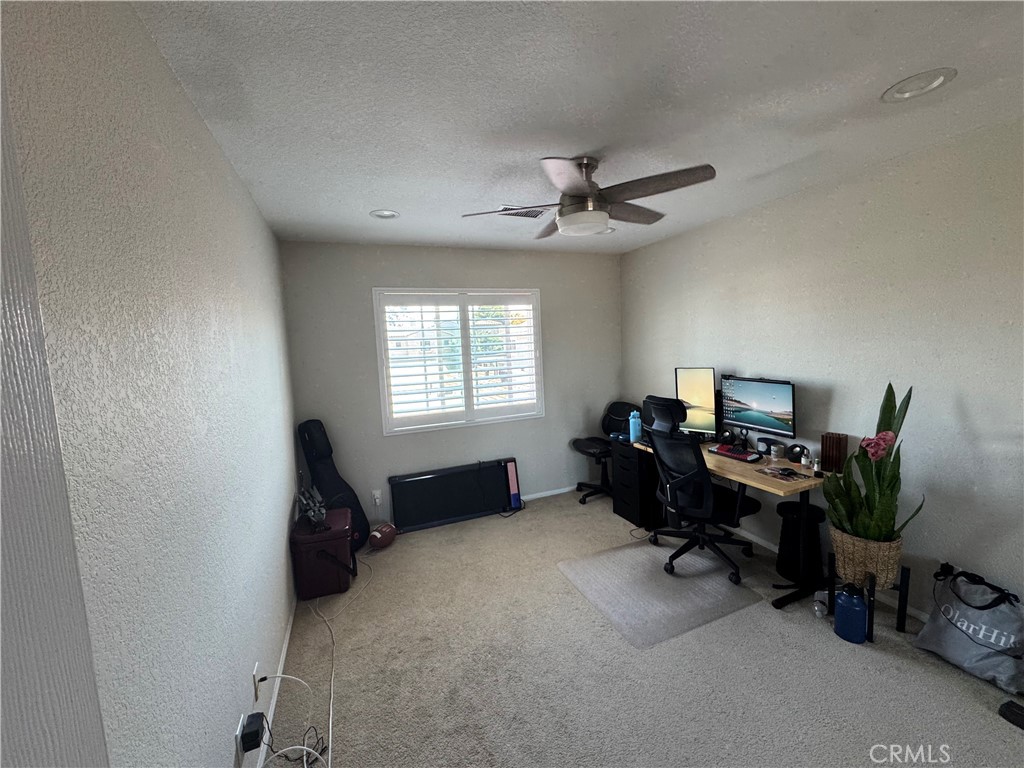 218 Ogle Street, Unit B Costa Mesa, CA 92627 - Photo 9 of 11 a view of a workspace with furniture and a window