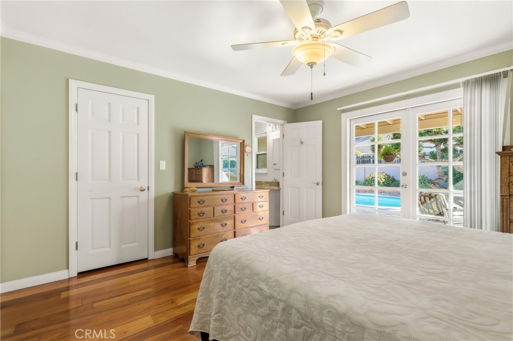 516 South Peregrine Street Anaheim, CA 92806 - Photo 21 of 34 a bedroom with a large bed and a chandelier