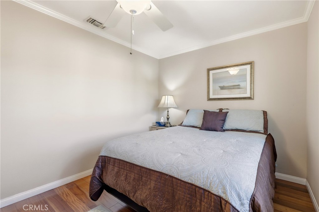 516 South Peregrine Street Anaheim, CA 92806 - Photo 23 of 34 a bedroom with a bed and a painting on the wall