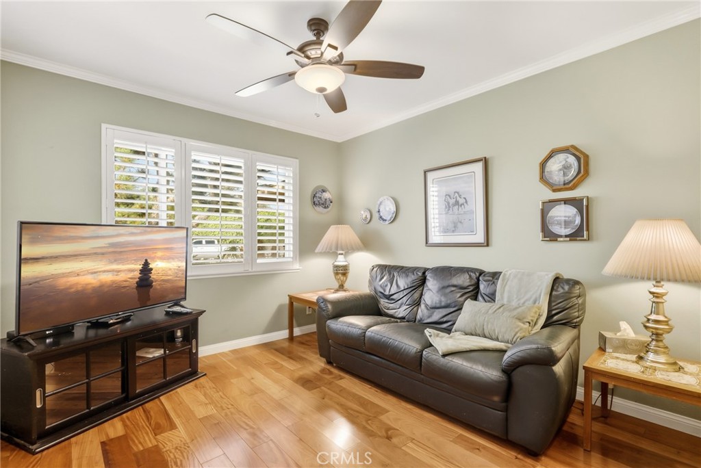 516 South Peregrine Street Anaheim, CA 92806 - Photo 10 of 34 a living room with furniture a large window and a flat screen tv