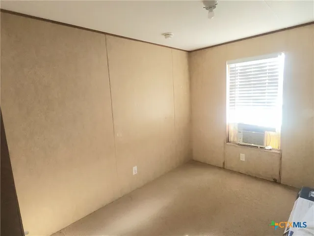 a kitchen with wooden cabinets