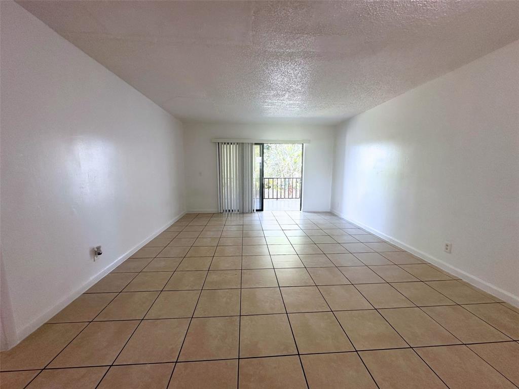 928 South Federal Highway, Unit 20 Lake Worth Beach, FL 33460 - Photo 2 of 12 a view of an empty room and window