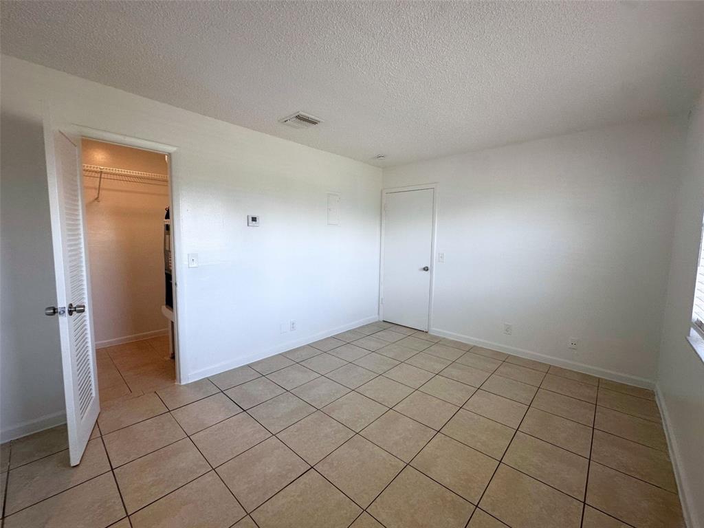 928 South Federal Highway, Unit 20 Lake Worth Beach, FL 33460 - Photo 5 of 12 a view of an empty room and window