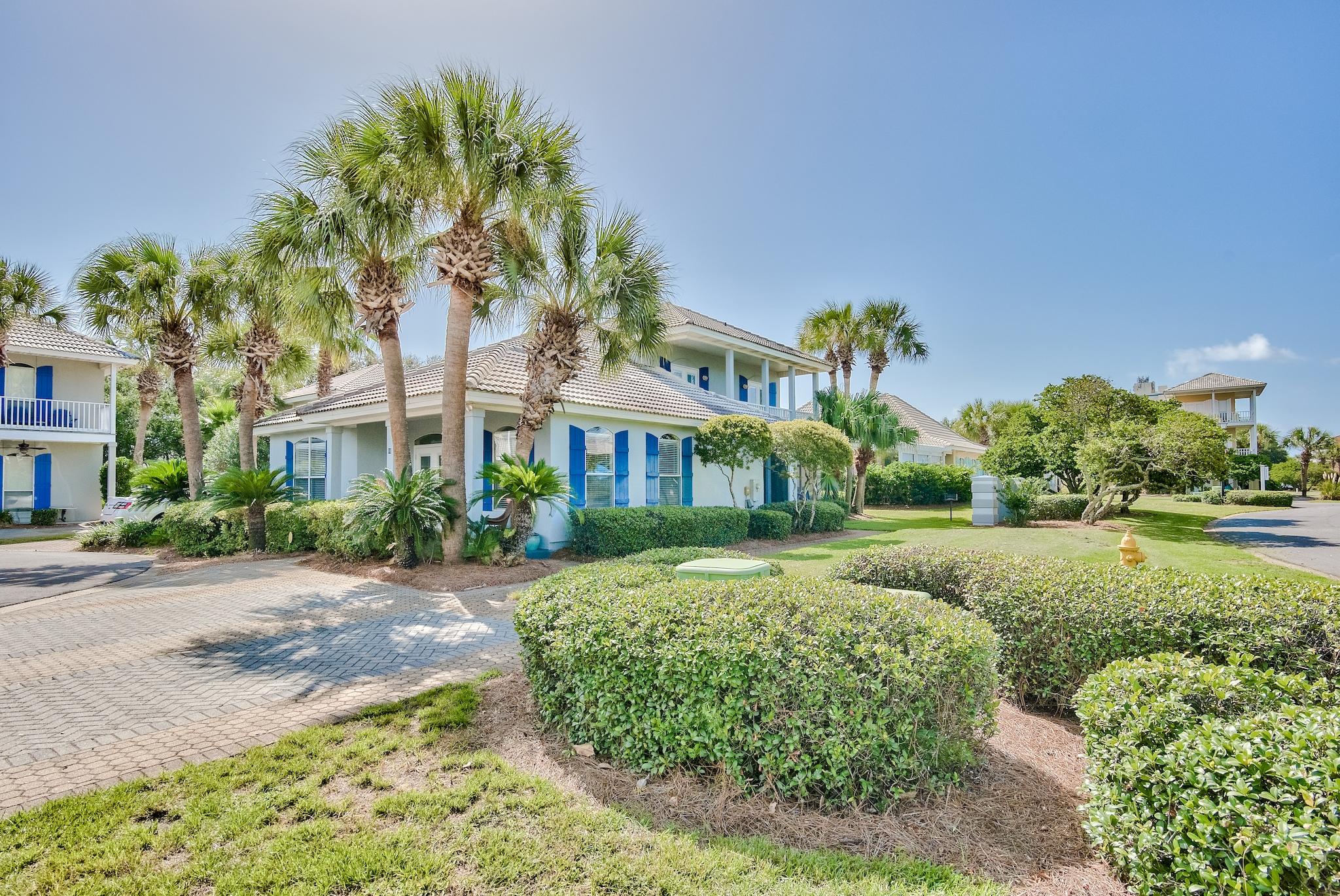 16 Ruby Cove Miramar Beach, FL 32550 - Photo 2 of 40 a front view of house with yard and green space