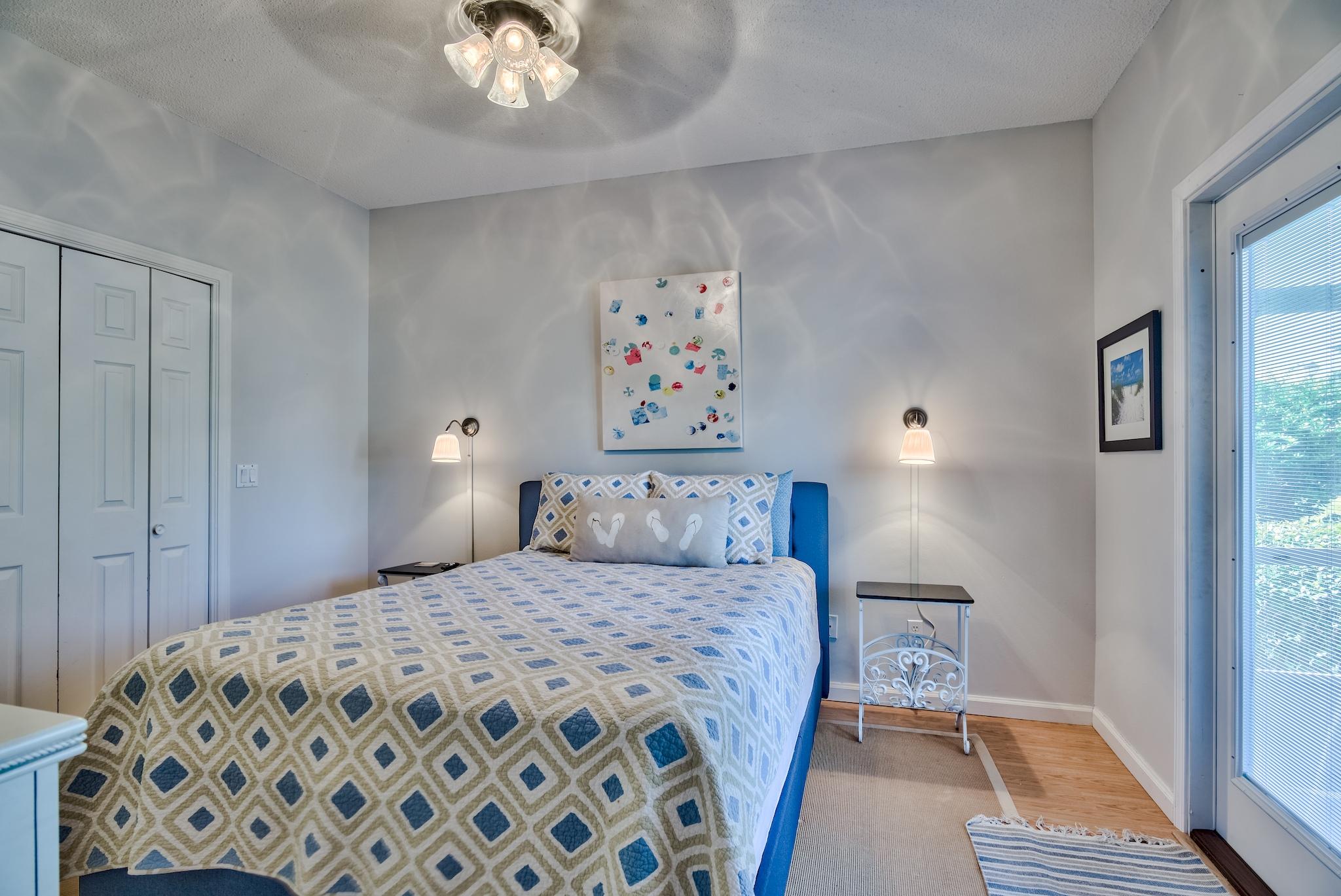 16 Ruby Cove Miramar Beach, FL 32550 - Photo 25 of 40 a bedroom with a large bed and a chandelier