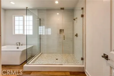 a bathroom with a bathtub and a shower
