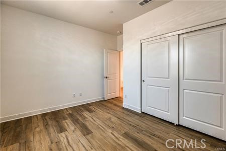 434 Harding Road Corona, CA 92879 - Photo 14 of 44 a view of an empty room with wooden floor and a window