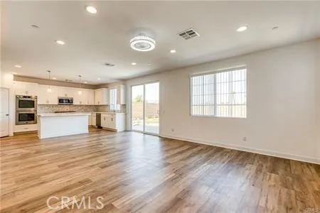 a view of kitchen with wooden floor