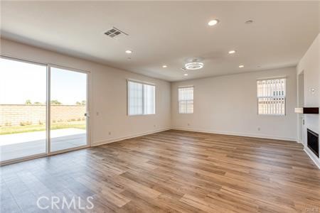 434 Harding Road Corona, CA 92879 - Photo 28 of 44 an empty room with wooden floor and windows