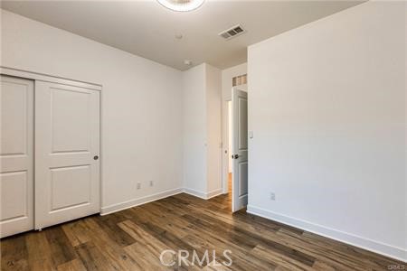 434 Harding Road Corona, CA 92879 - Photo 38 of 44 a view of an empty room with wooden floor