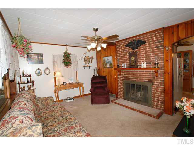 4317 Kerley Road Durham, NC 27705 - Photo 7 of 25 An Arched Opening is between the Living Room and the Dining Area.