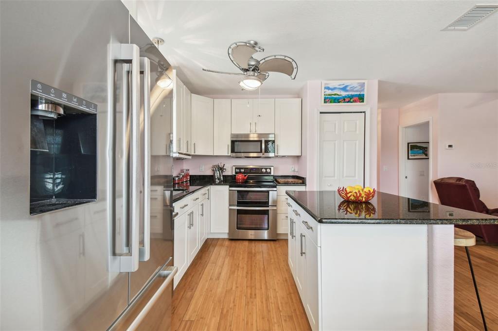 3227 Rose Arbor Drive Hernando Beach, FL 34607 - Photo 15 of 52 a kitchen with stove cabinets and a refrigerator