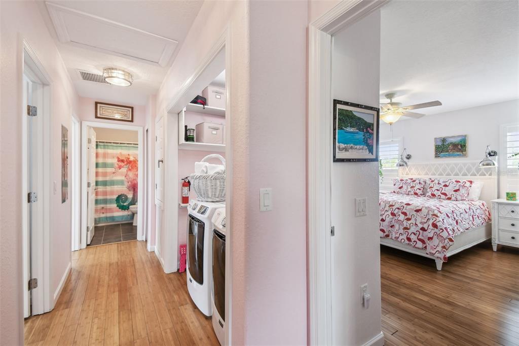 3227 Rose Arbor Drive Hernando Beach, FL 34607 - Photo 17 of 52 a bedroom with wooden floor and a bed