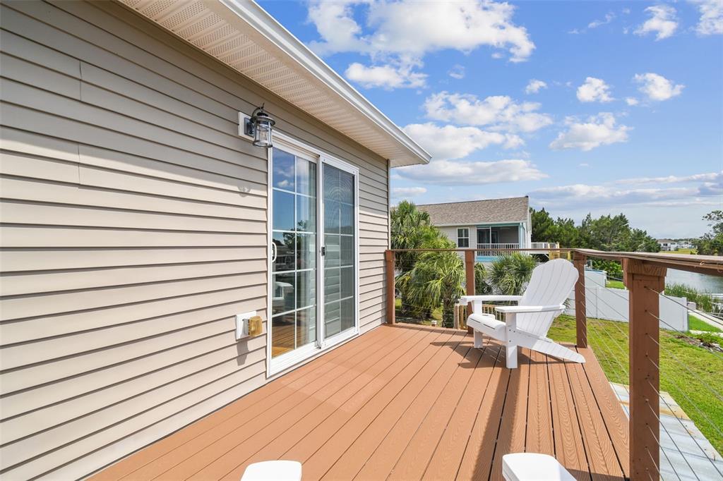 3227 Rose Arbor Drive Hernando Beach, FL 34607 - Photo 23 of 52 a view of deck with patio