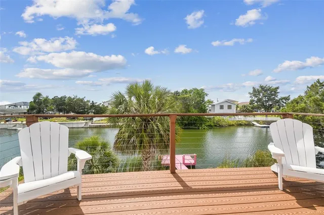 a view of a room with wooden floor and windows