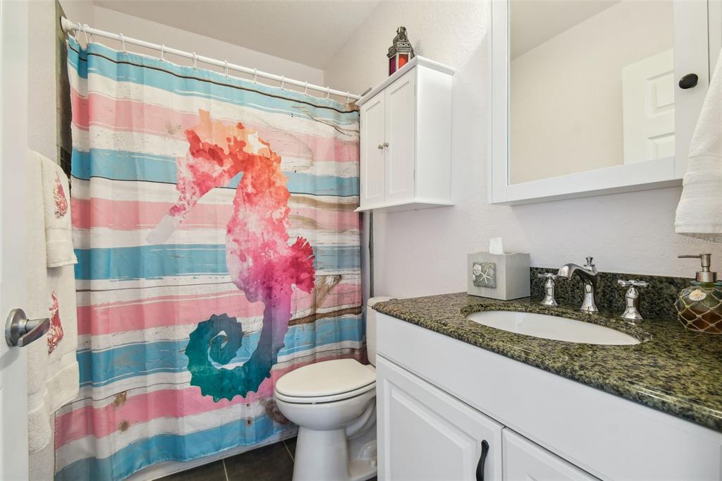 3227 Rose Arbor Drive Hernando Beach, FL 34607 - Photo 27 of 52 a bathroom with a sink toilet and shower