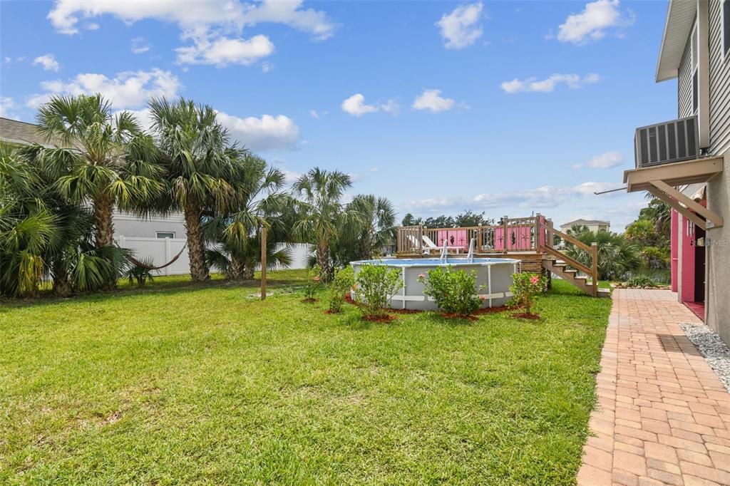 3227 Rose Arbor Drive Hernando Beach, FL 34607 - Photo 29 of 52 a view of a garden with houses