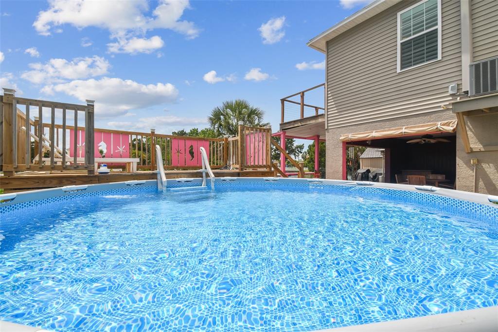 3227 Rose Arbor Drive Hernando Beach, FL 34607 - Photo 31 of 52 a view of outdoor space with deck and living space