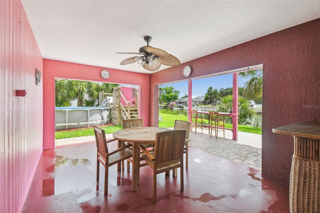 3227 Rose Arbor Drive Hernando Beach, FL 34607 - Photo 38 of 52 a view of a dining room with furniture window and outside view