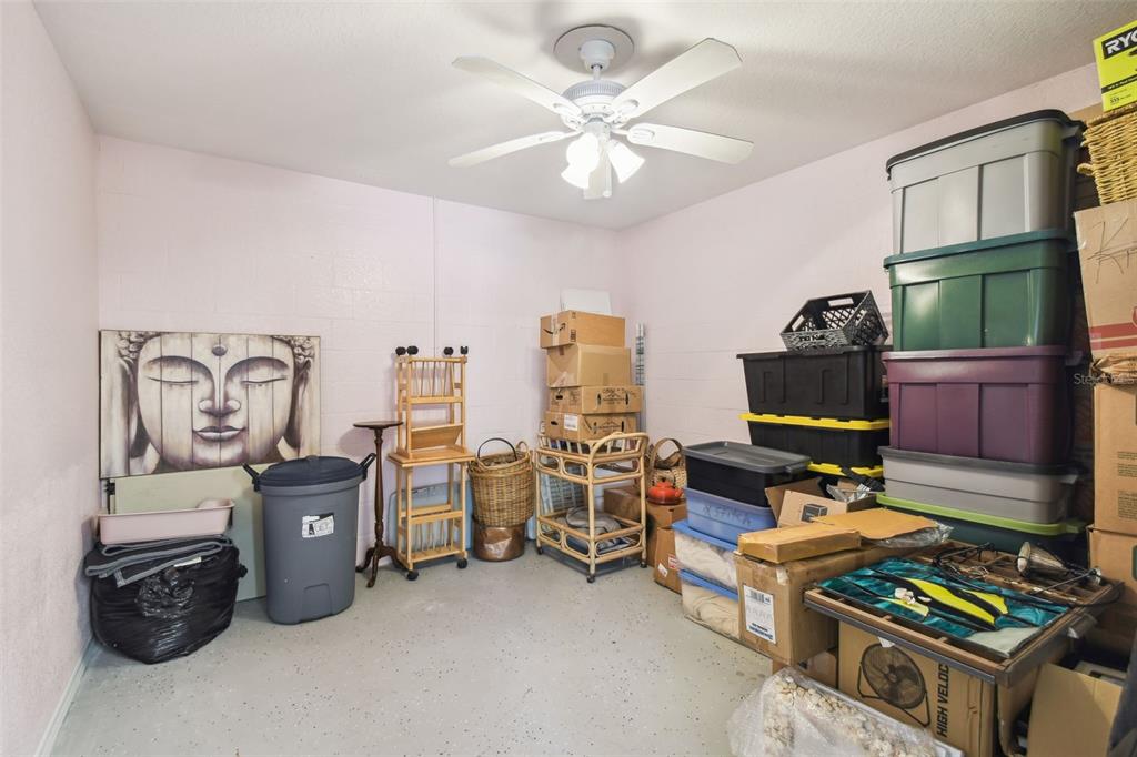 3227 Rose Arbor Drive Hernando Beach, FL 34607 - Photo 44 of 52 a work room with furniture and a flat screen tv