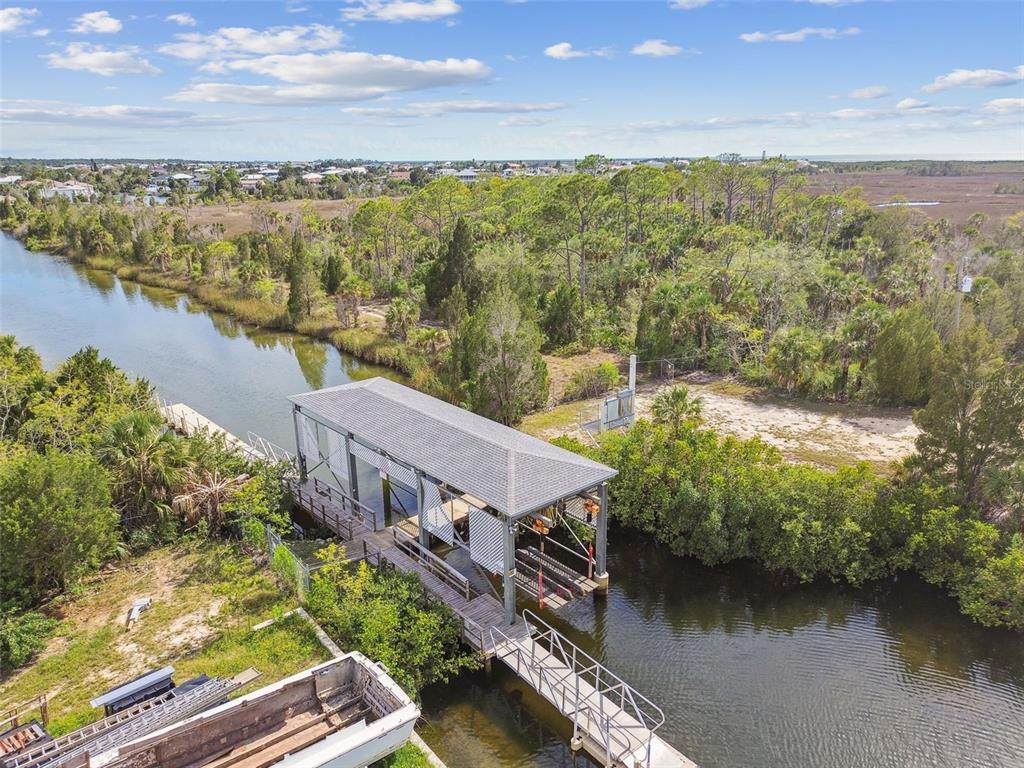 3227 Rose Arbor Drive Hernando Beach, FL 34607 - Photo 48 of 52 a view of a lake with houses in the back