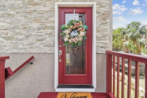 a view of a red door and chair