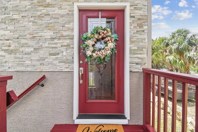 a view of a red door and chair