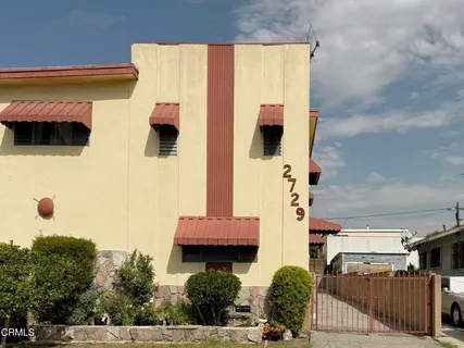 a front view of a house with parking