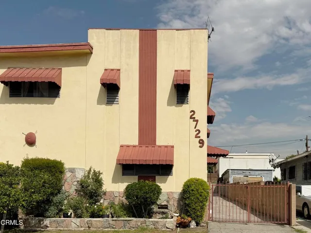 a front view of a house with parking