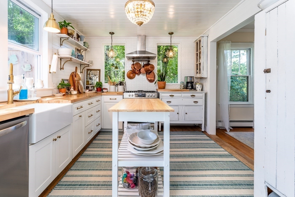 48 Puritan Road Bourne, MA 02532 - Photo 20 of 42 a kitchen with stainless steel appliances a sink and a large window