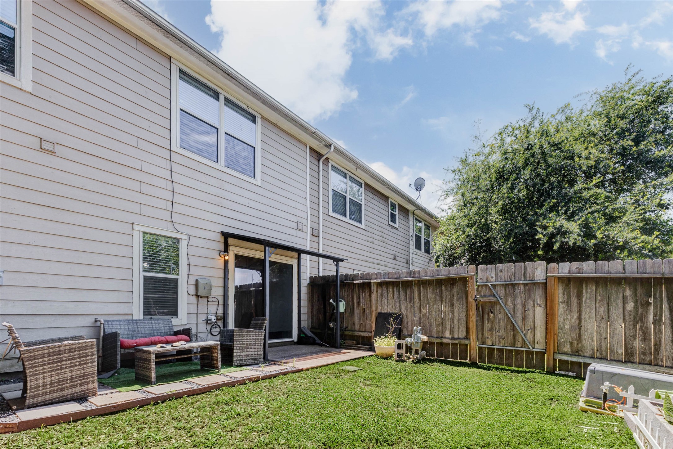 14522 Durham Chase Lane Houston, TX 77095 - Photo 33 of 40 a backyard of a house with outdoor seating and green space