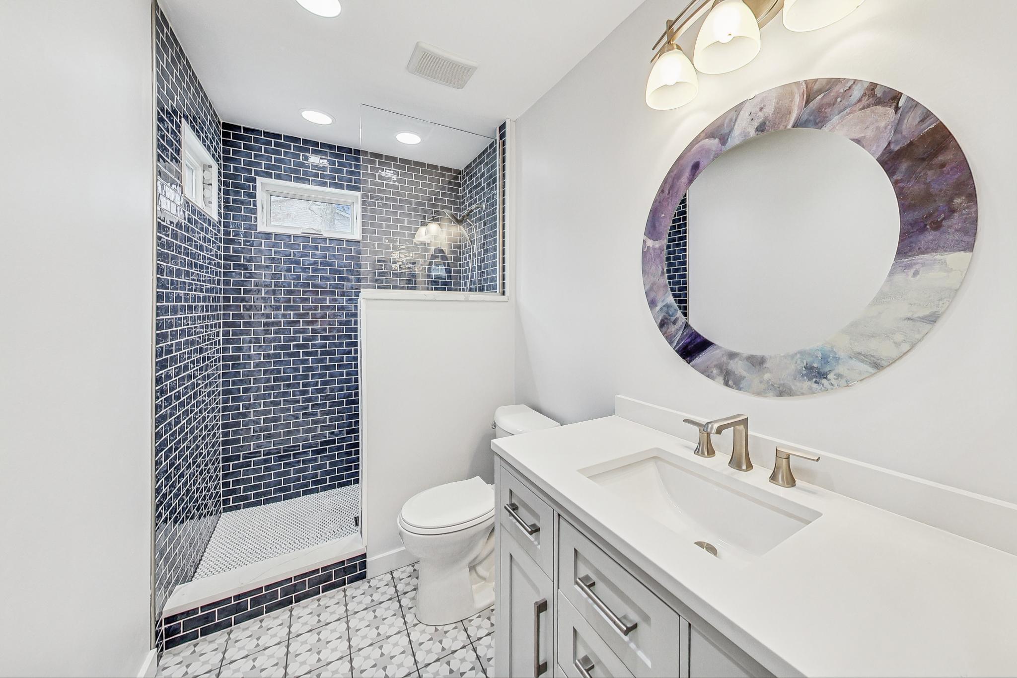 22 Chrismar Road Ogden Dunes, IN 46368 - Photo 13 of 26 a bathroom with a sink a toilet and shower