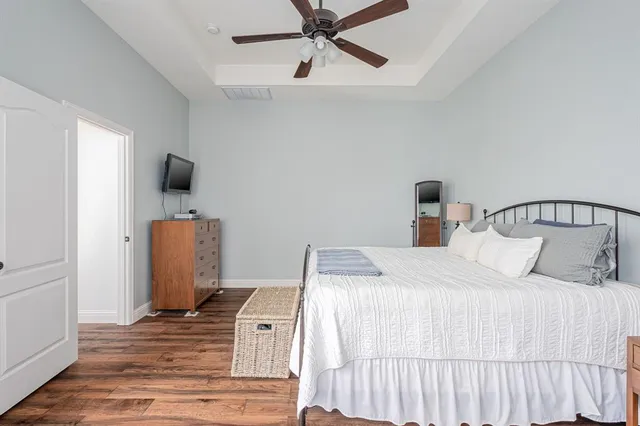 a spacious bathroom with a double vanity sink a mirror and a bathtub