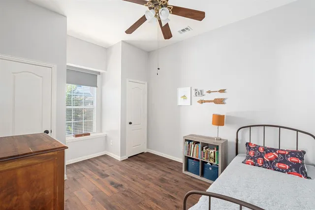 a bathroom with a sink vanity mirror and toilet