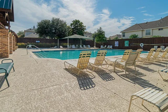 a view of a patio with a table chairs and a patio