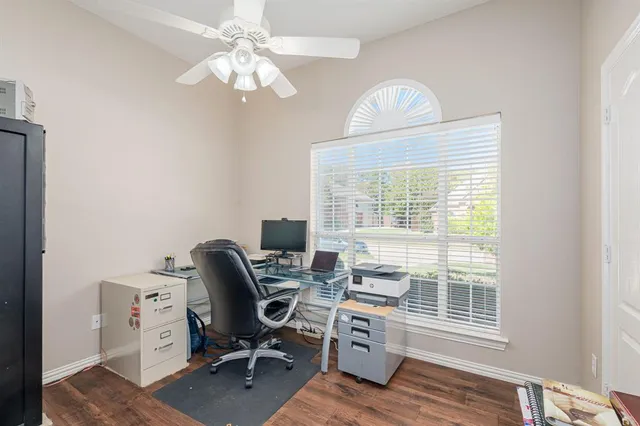 a large kitchen with a table and chairs