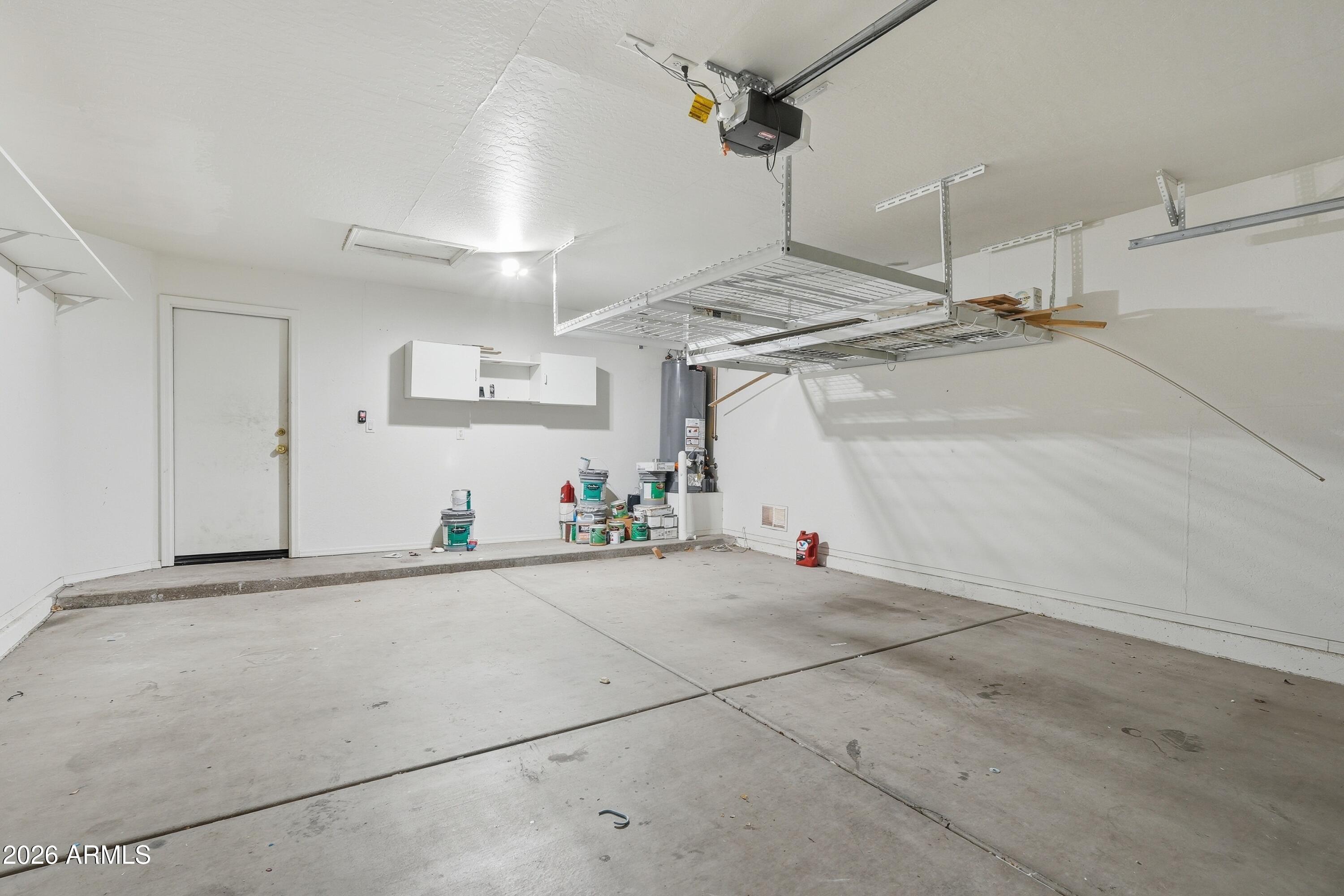 3242 East Bonanza Road Gilbert, AZ 85297 - Photo 35 of 36 a view of a garage with furniture