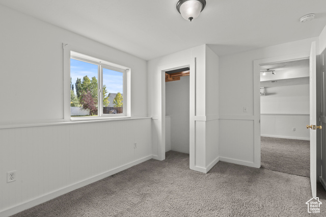 1099 Three Point Avenue Logan, UT 84321 - Photo 21 of 27 Unfurnished bedroom with carpet and a closet