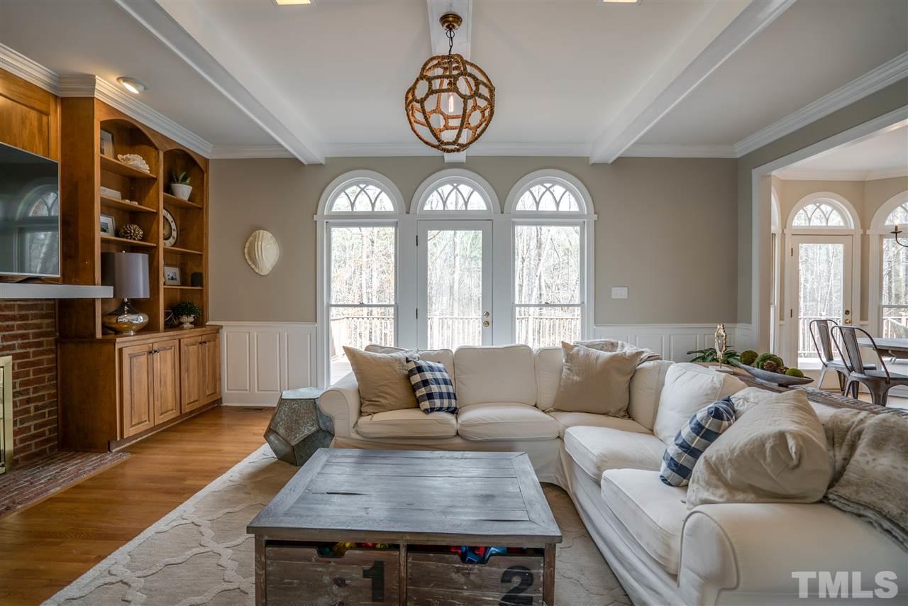5624 North Hawthorne Way Raleigh, NC 27613 - Photo 5 of 25 a living room with furniture and a large window