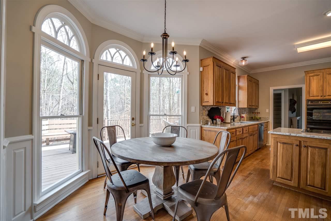 5624 North Hawthorne Way Raleigh, NC 27613 - Photo 8 of 25 a view of a dining room with furniture window and outside view