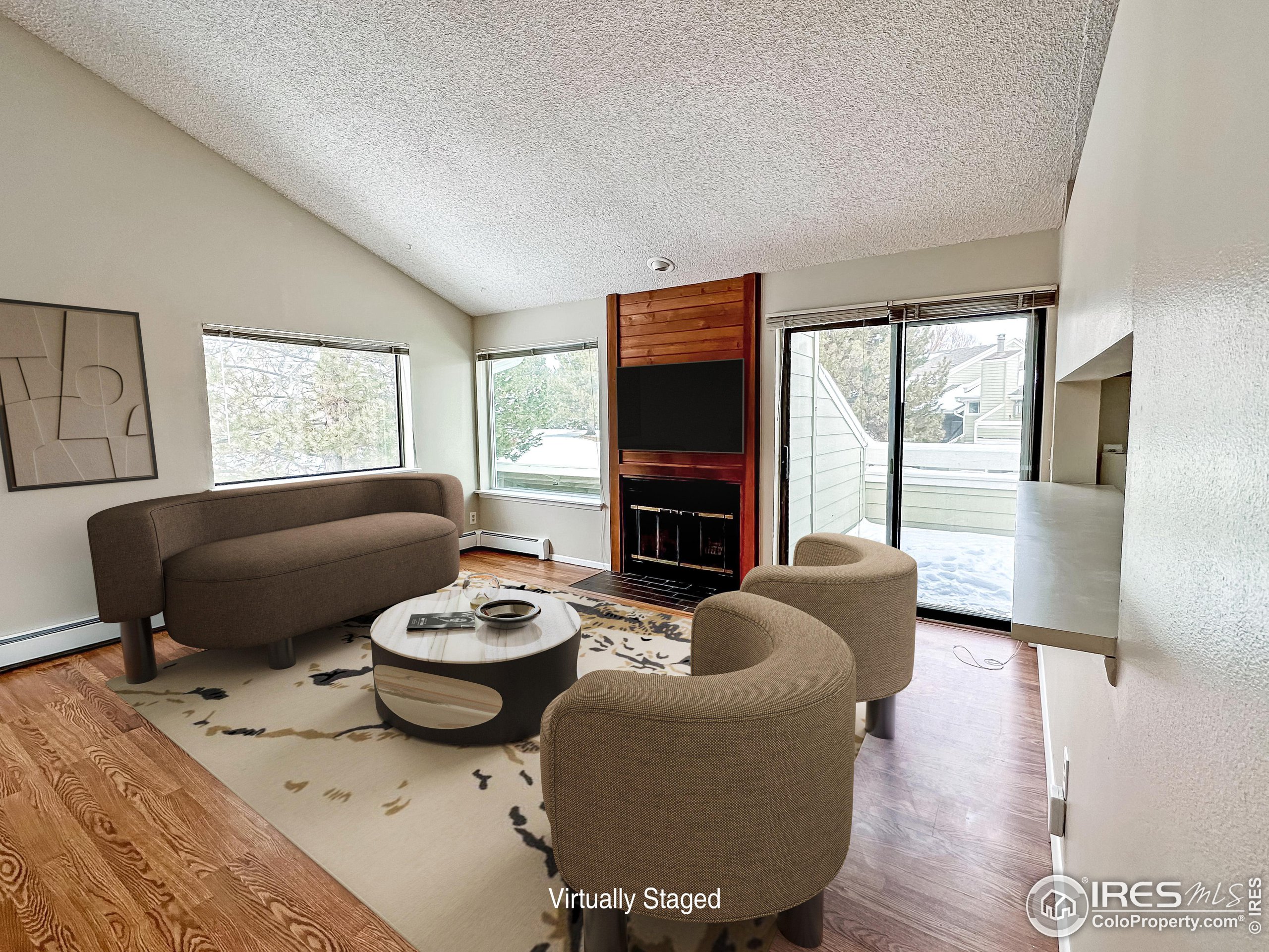 a living room with furniture a flat screen tv and a large window