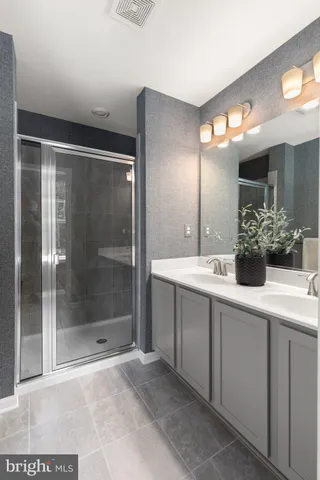 a bathroom with a sink and mirror