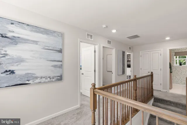 a view of a hallway with closet area