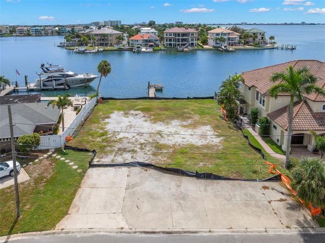 an aerial view of a house with a lake view