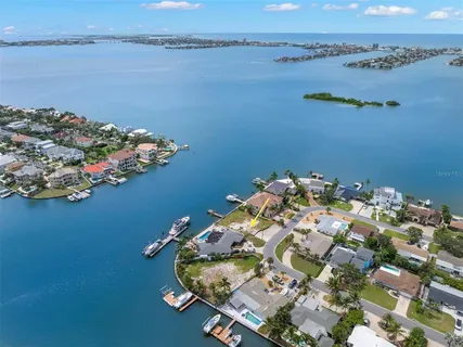 an aerial view of a house with a lake view