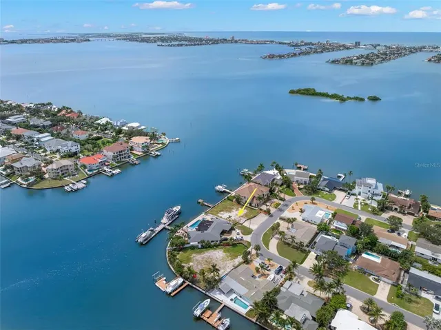 an aerial view of a house with a lake view