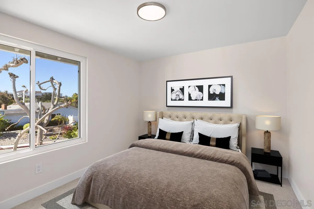 3252 Eichenlaub Street San Diego, CA 92117 - Photo 15 of 36 a bedroom with bed and wall painting with wooden floor