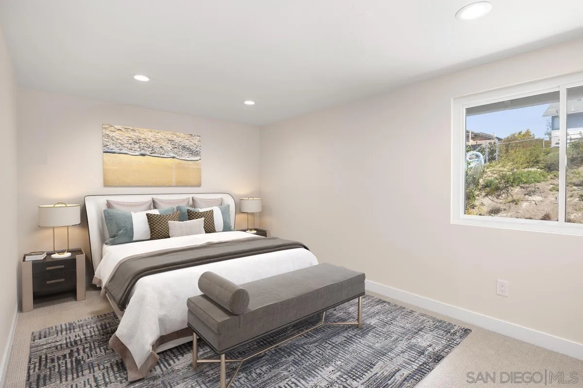 3252 Eichenlaub Street San Diego, CA 92117 - Photo 16 of 36 a bed room with a bed and a painting