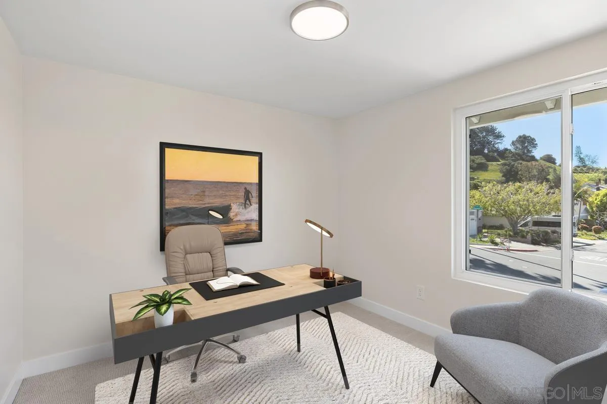 3252 Eichenlaub Street San Diego, CA 92117 - Photo 17 of 36 a living room with a couch and a potted plant