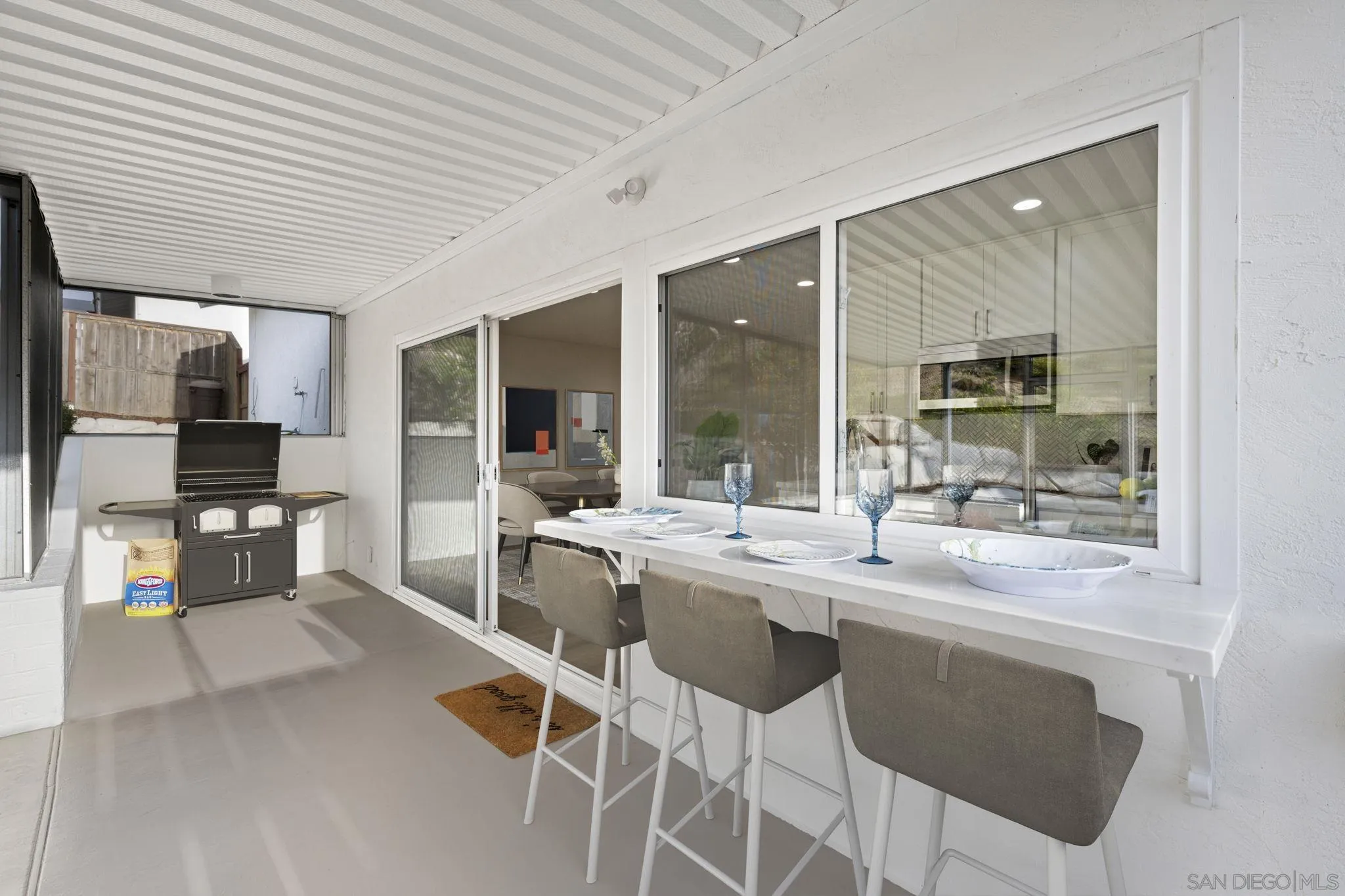 3252 Eichenlaub Street San Diego, CA 92117 - Photo 19 of 36 a dining hall with stainless steel appliances granite countertop a sink and cabinets
